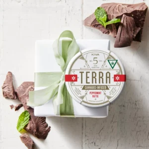 Peppermint Pattie CBN Terra Bites tin with dark chocolate patties on a soft blanket